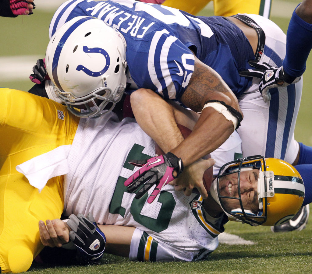Green Bay Packers quarterback Aaron Rodgers (12) is sacked and hit by Indianapolis Colts inside linebacker Jerrell Freeman (50) in second half action. The Colts defeated the Green Bay Packers 30-27 on Sunday, October 7, 2012, in Indianapolis, Indiana. (Sam Riche/MCT) ORG XMIT: 1129744